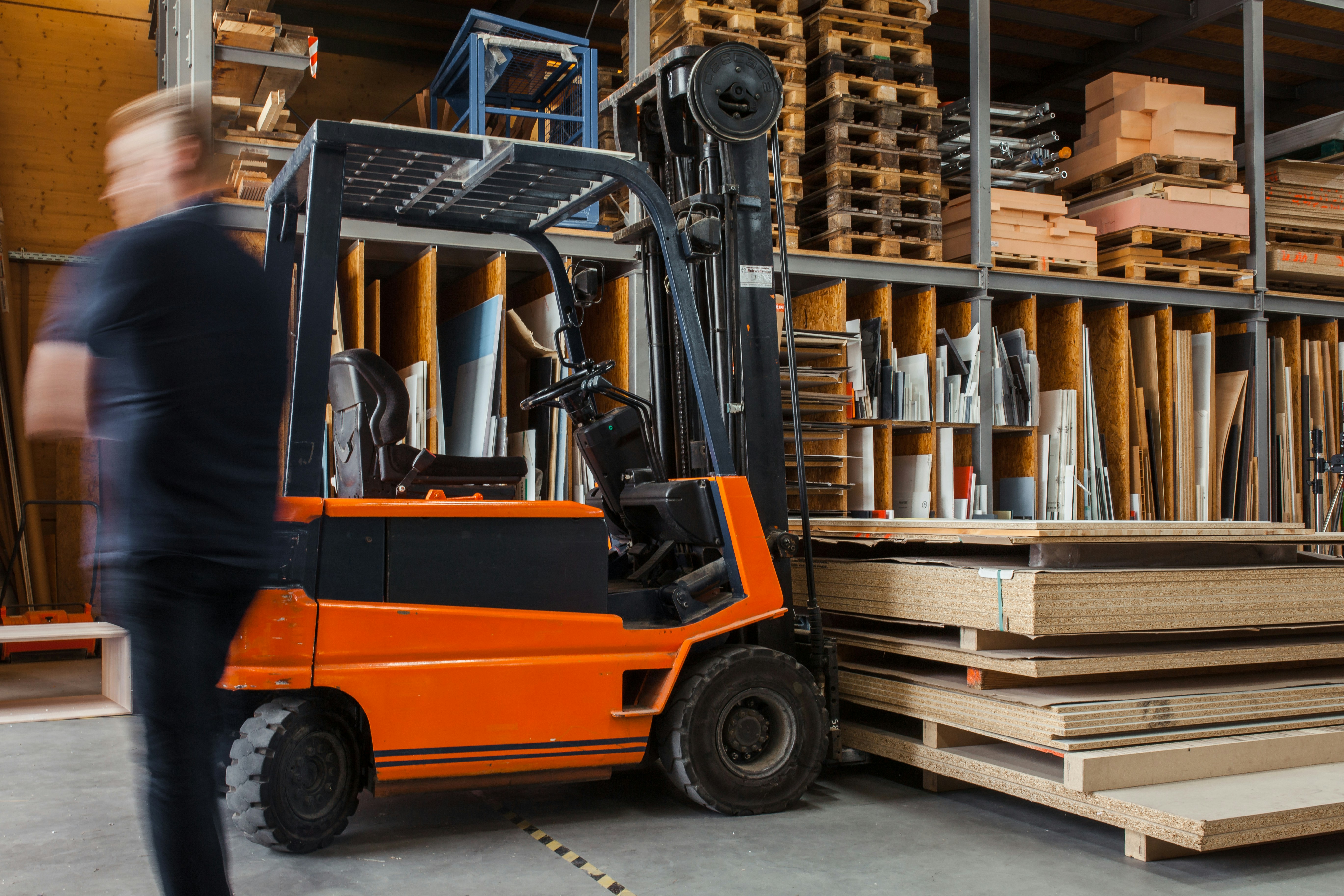 A forklift truck in a warehouse setting